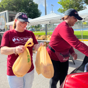 Grant Miller visits Be Strong International's Food Drive